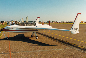 Vintage aircraft lineup on a sunny airstrip