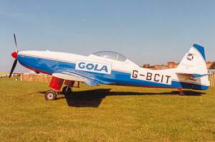 Vintage aircraft rests under a clear blue sky