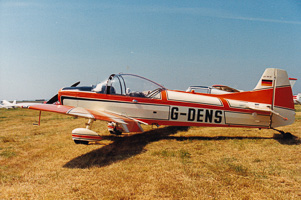 Vintage aircraft resting on a sunlit runway