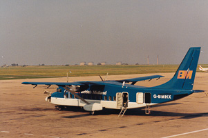 Vintage aircraft on a sunlit tarmac at dusk