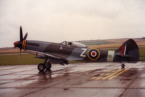 Vintage aircraft stands ready on the runway