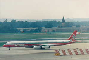 Historic airplane taxiing at the airport terminal