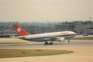 Airliner takes off from busy international airport