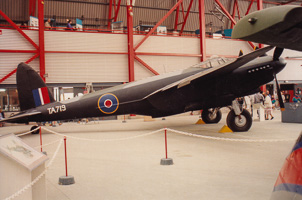 Historic aircraft on display in a vibrant hangar