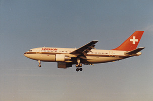 Swissair aircraft preparing for landing at sunset