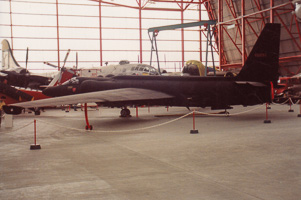 Historic aircraft showcased in a sprawling hangar