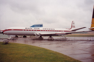 Historic plane at a rainy airport