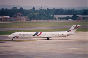 Jet flying high over busy airport