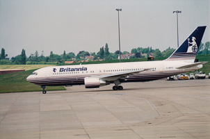 Boeing 767 taxiing at the airport on a sunny day