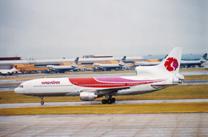 Colorful jet departs busy airport runway