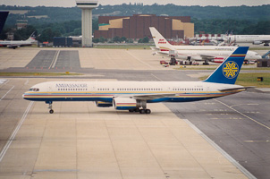 Airplane taxiing at the airport under cloudy skies