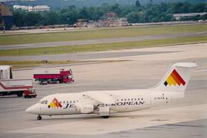 Vintage planes on runway at busy airport