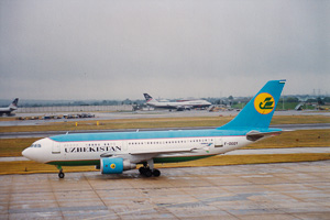 Airplane preparing for takeoff at a cloudy airport