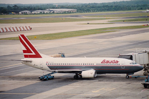 Vintage aircraft at the bustling airport terminal