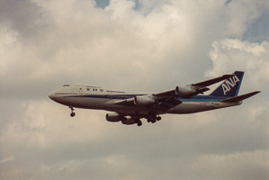 Airplane soaring through clouds