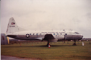Historic aircraft on display in an open field