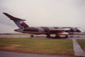 Vintage military aircraft displayed on cloudy day